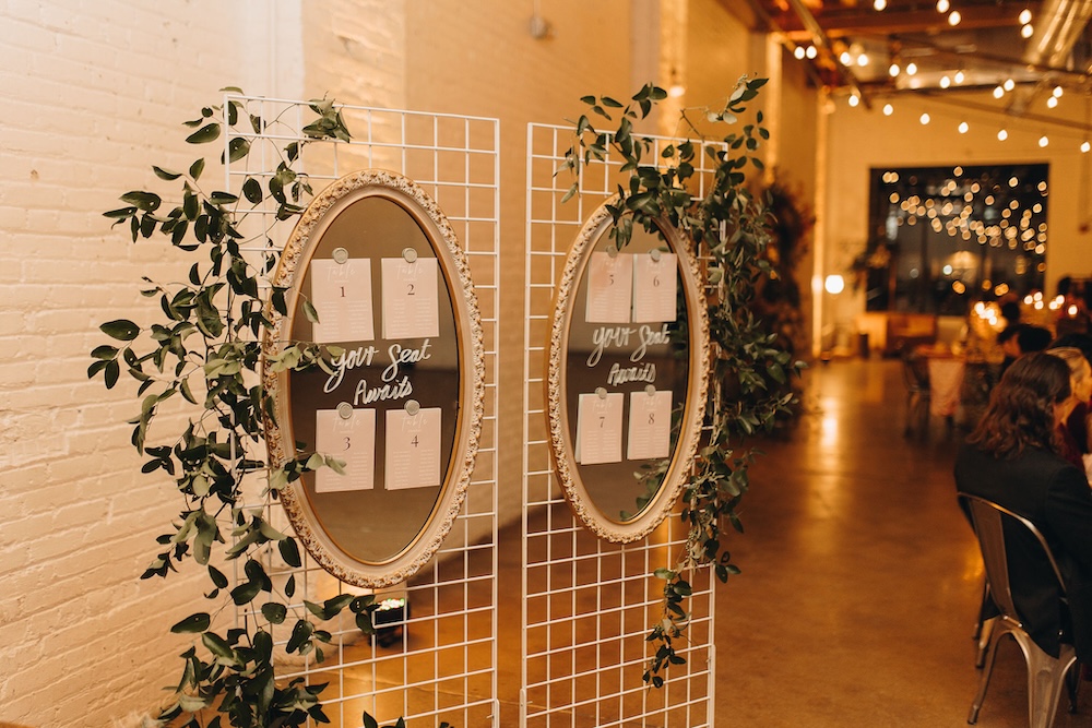 SKYLIGHT's in-house grid wall with a seating chart for a wedding