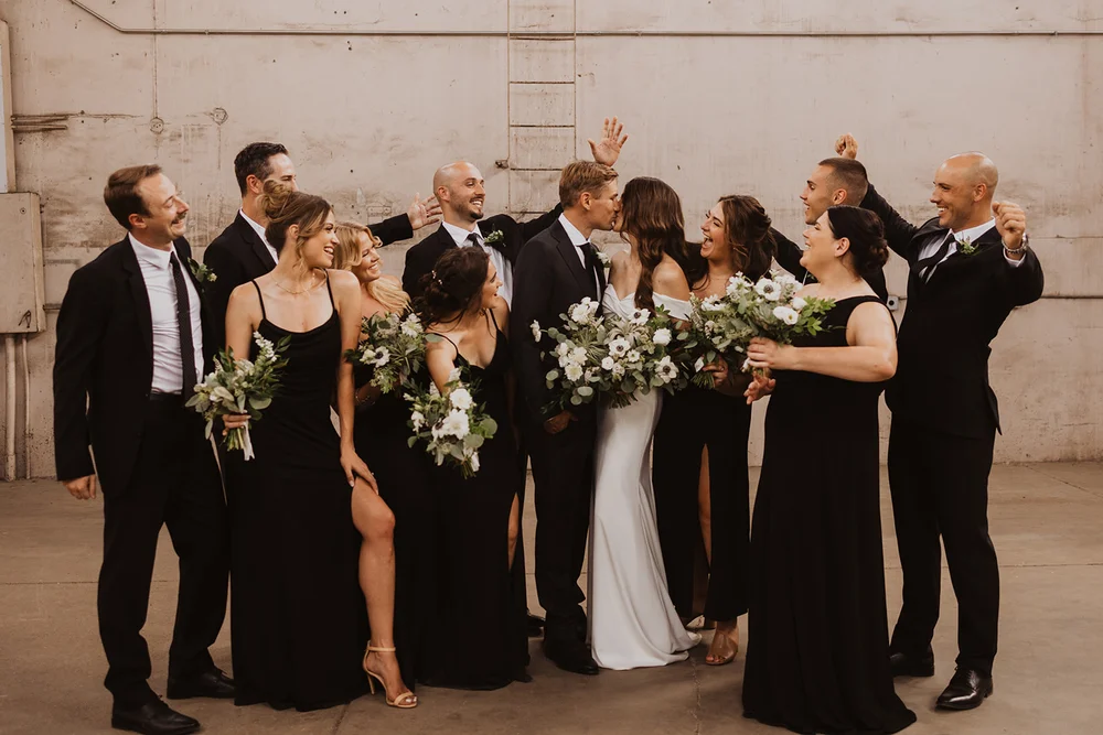 Wedding party taking photos outside of Blanc in Denver