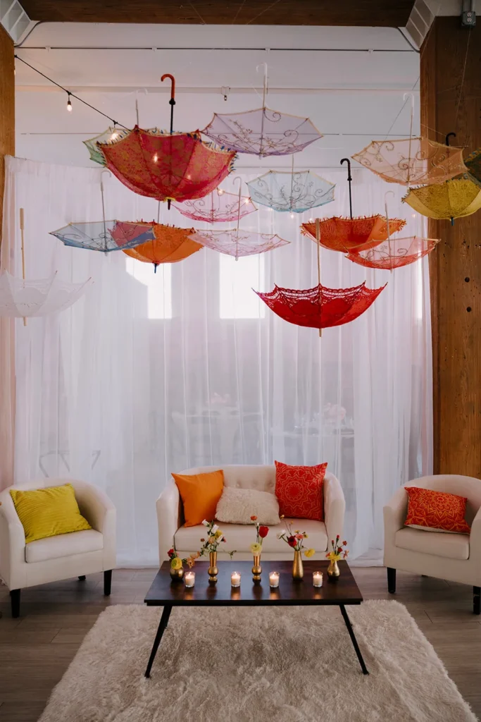 Colorful umbrellas and lounge furniture set up for an Indian wedding at THE 101