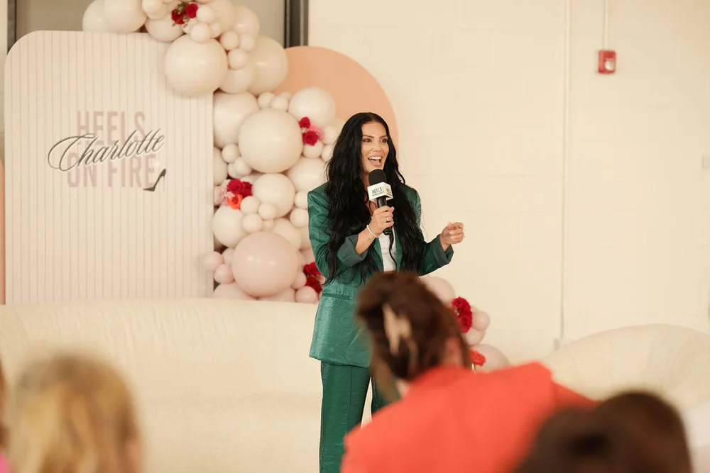 Woman speaking into a mic