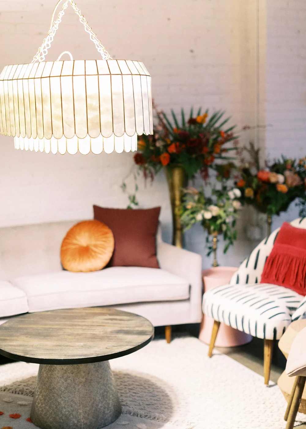 Holiday lounge area with bright lighting, cozy seating, and festive décor for a seasonal party