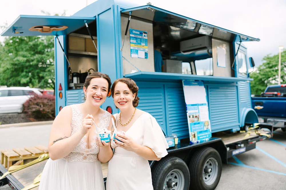 LGBTQ+ brides smiling at their wedding — 828 Venues LGBTQ+ friendly wedding planning